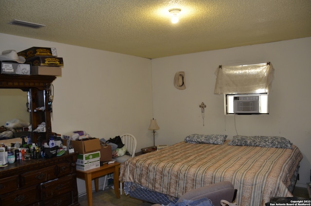 bedroom featuring carpet floors and a textured ceiling