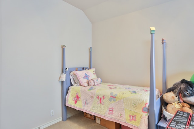 bedroom with light carpet and vaulted ceiling