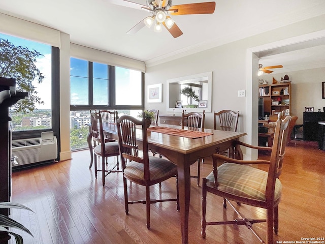 dining space with light hardwood / wood-style floors, ceiling fan, and ornamental molding