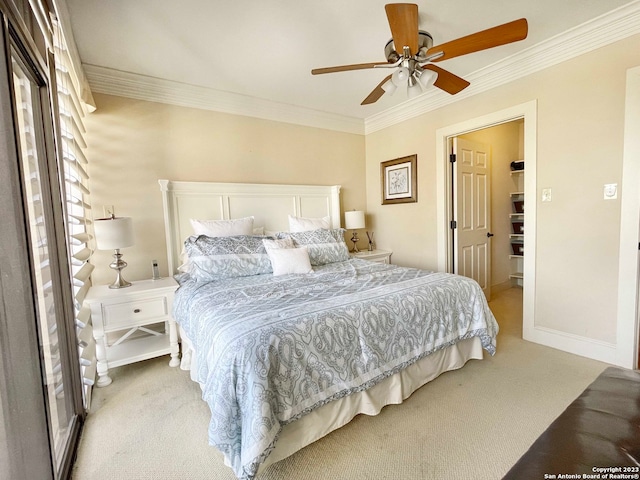 bedroom with light carpet, crown molding, and ceiling fan