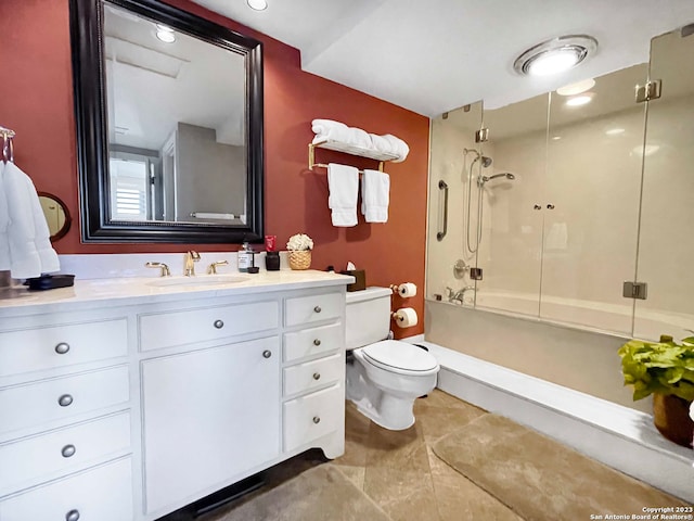 bathroom with vanity, tile flooring, a shower, and toilet