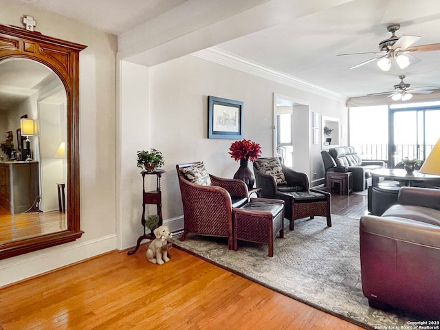 living room featuring wood-type flooring and ceiling fan