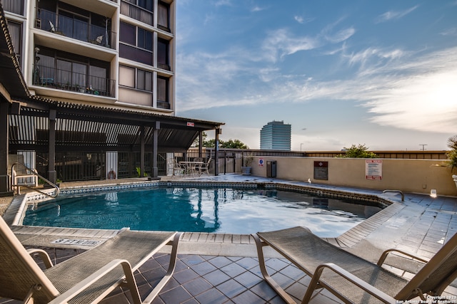 view of swimming pool with a patio