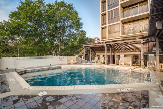 view of swimming pool featuring a patio area