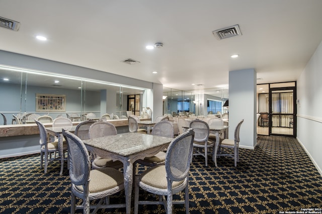 dining space with dark carpet