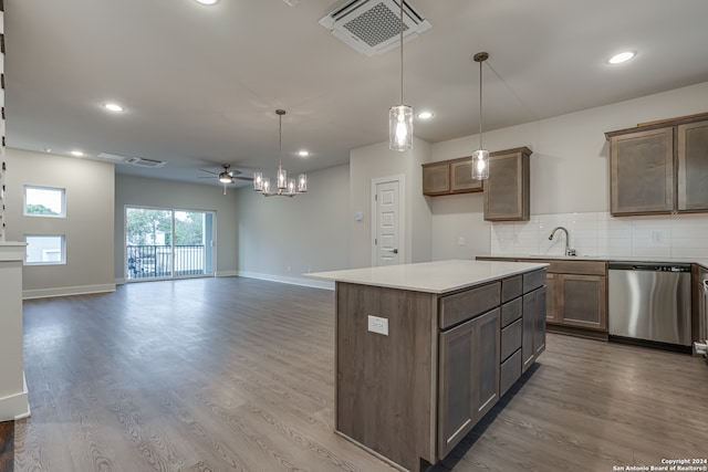 kitchen with ceiling fan, a center island, stainless steel dishwasher, pendant lighting, and wood-type flooring