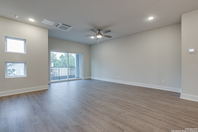 empty room featuring ceiling fan and dark hardwood / wood-style floors