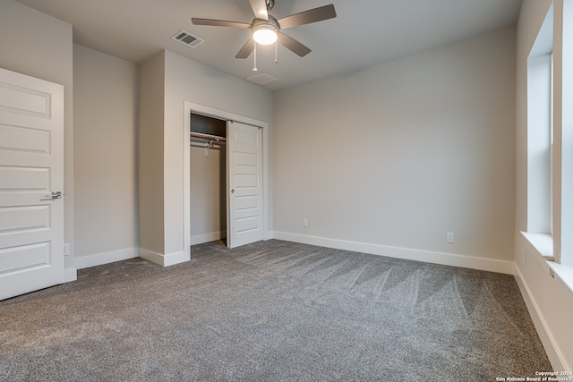 unfurnished bedroom featuring carpet, a closet, and ceiling fan