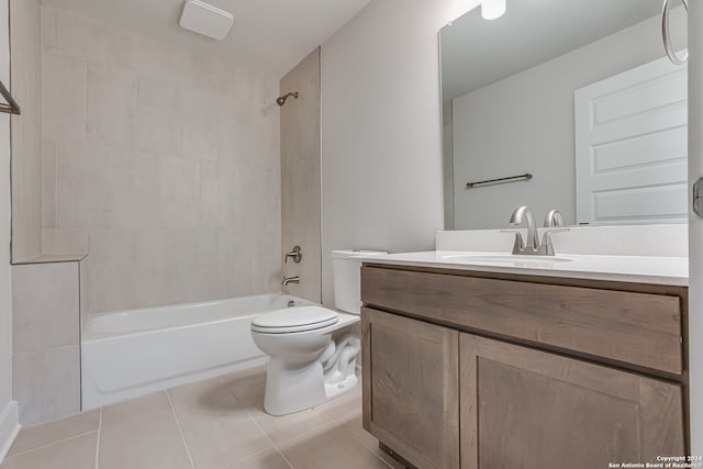 full bathroom featuring tile patterned flooring, vanity, toilet, and tiled shower / bath