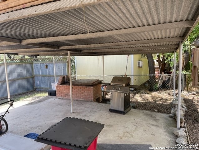 view of patio with a carport and area for grilling