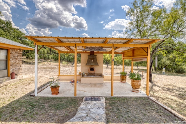 view of terrace with a fireplace