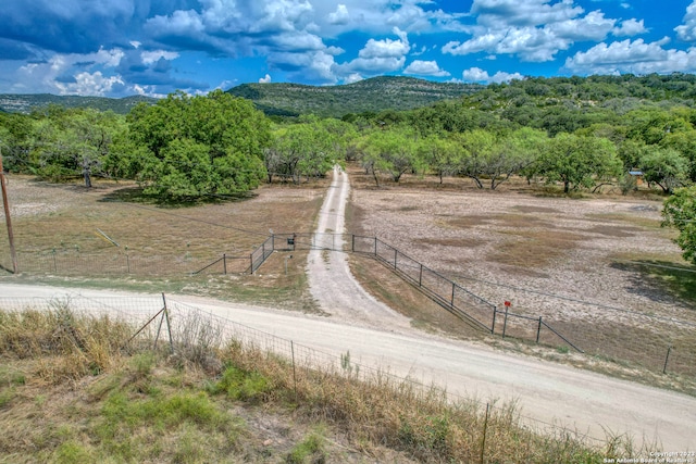 birds eye view of property featuring a mountain view and a rural view