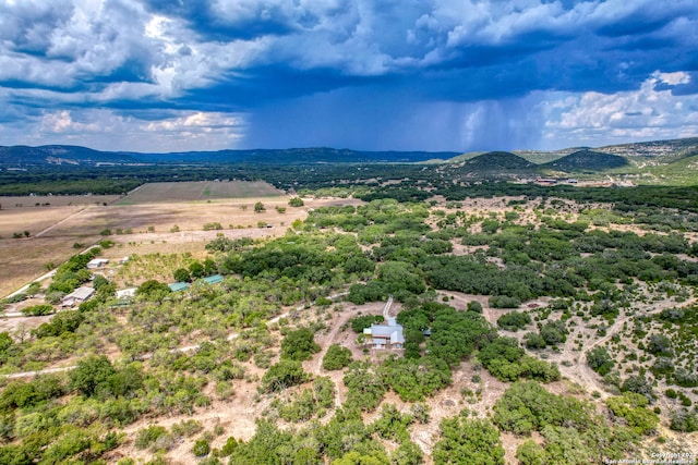 birds eye view of property with a mountain view