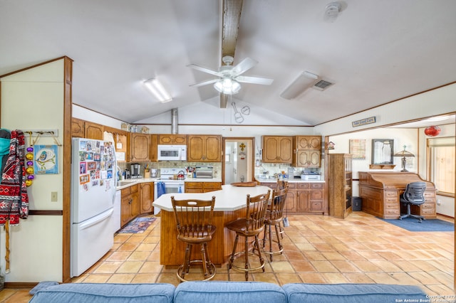 kitchen featuring white appliances, ceiling fan, vaulted ceiling, and light tile floors