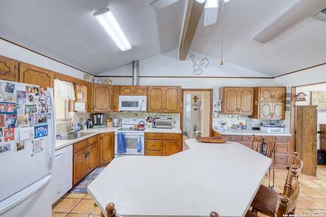 kitchen with light tile floors, vaulted ceiling with beams, white appliances, a breakfast bar area, and sink