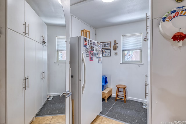 interior space featuring light tile floors