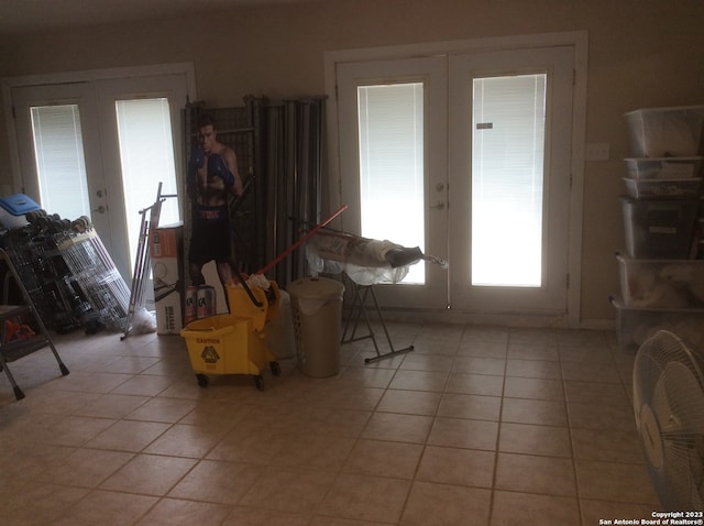 interior space with french doors and light tile flooring