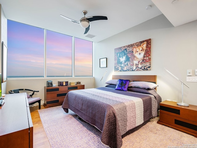 bedroom featuring ceiling fan and light wood-type flooring