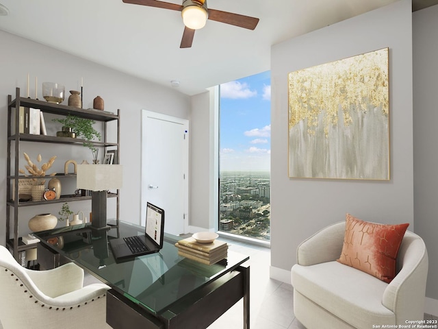 living area featuring plenty of natural light, light tile floors, ceiling fan, and a wall of windows