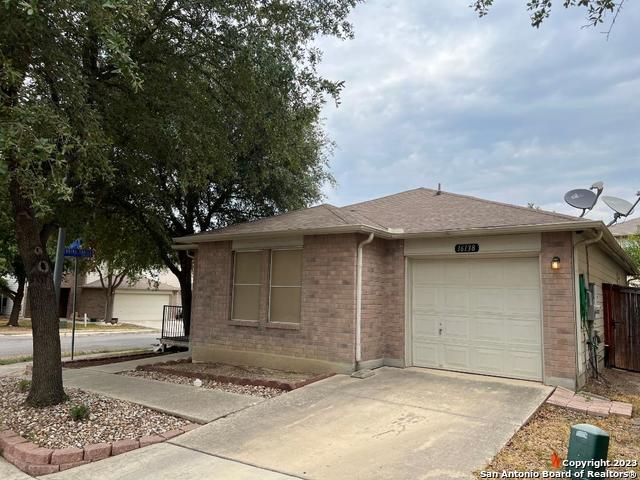 single story home featuring a garage