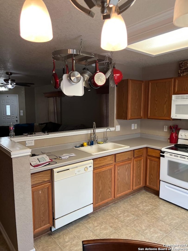 kitchen with light tile floors, ceiling fan, white appliances, and sink