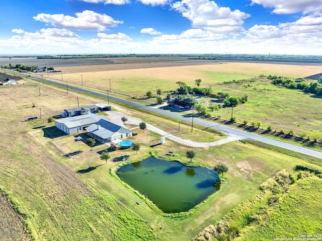 aerial view with a water view and a rural view