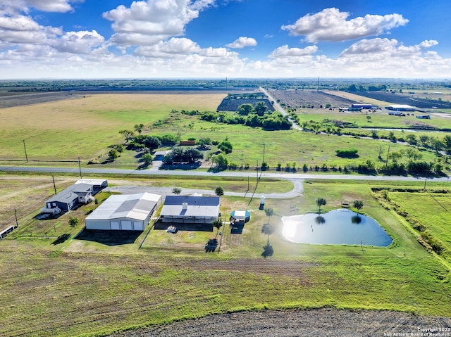 drone / aerial view with a water view and a rural view