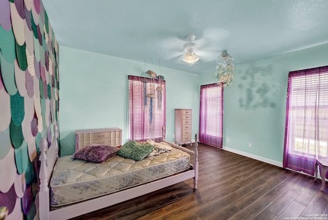 bedroom featuring ceiling fan and dark hardwood / wood-style flooring