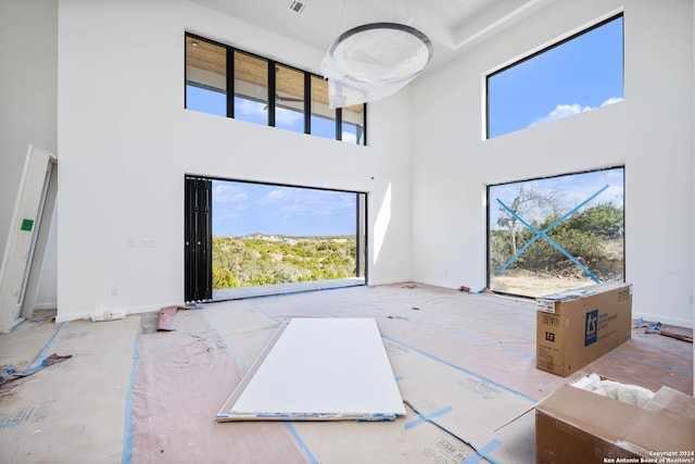 living room featuring a high ceiling