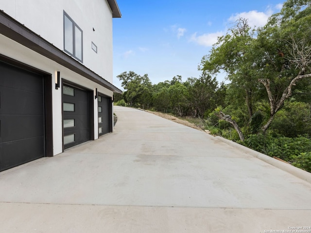 view of patio featuring a garage