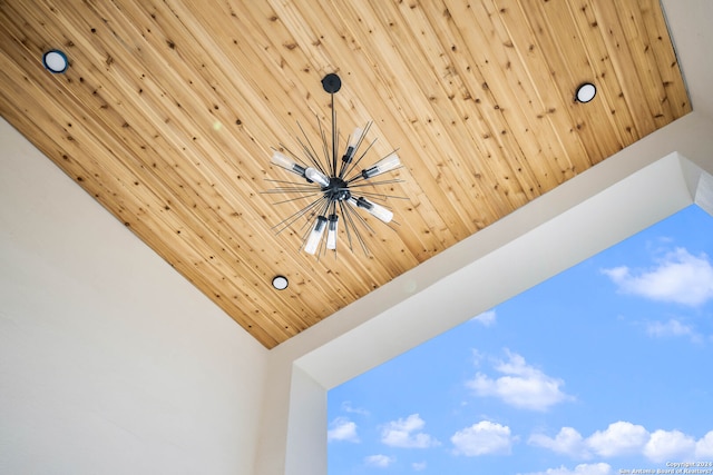 interior details featuring wooden ceiling and an inviting chandelier