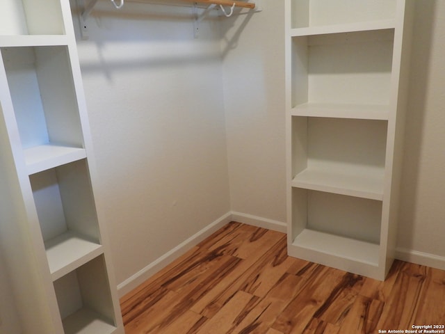 spacious closet with wood finished floors