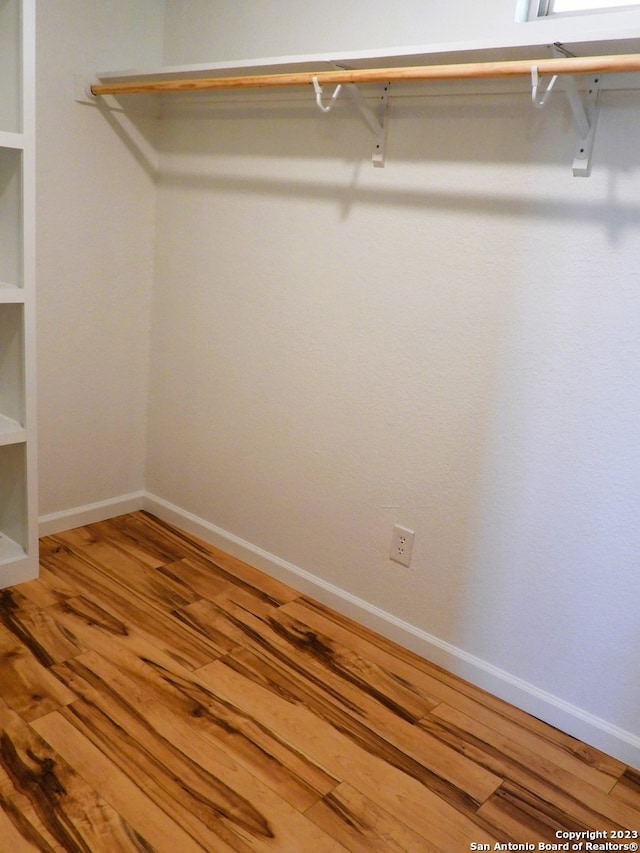 spacious closet with wood finished floors