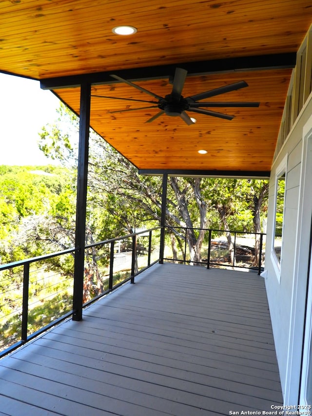 wooden terrace with a ceiling fan