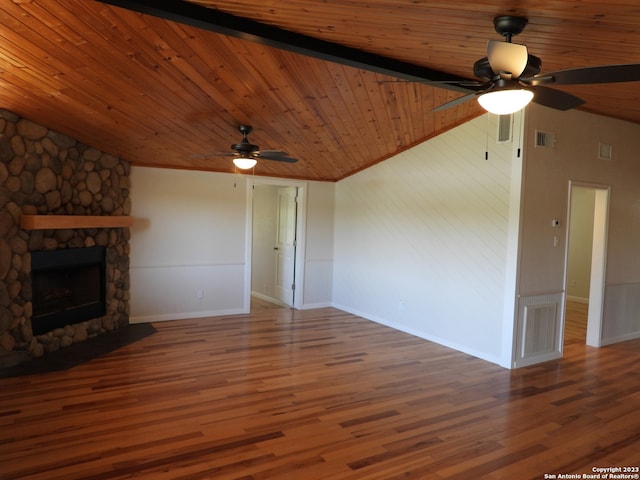 unfurnished living room featuring lofted ceiling, ceiling fan, a fireplace, wood finished floors, and wood ceiling