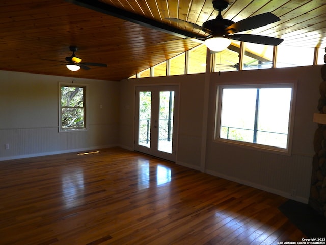 empty room featuring lofted ceiling, wooden ceiling, hardwood / wood-style flooring, and a ceiling fan