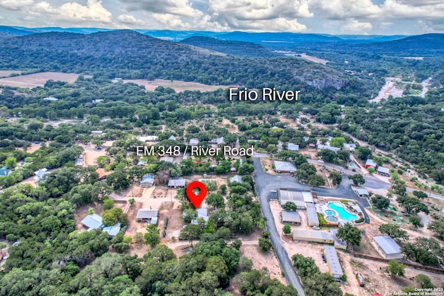 birds eye view of property with a mountain view