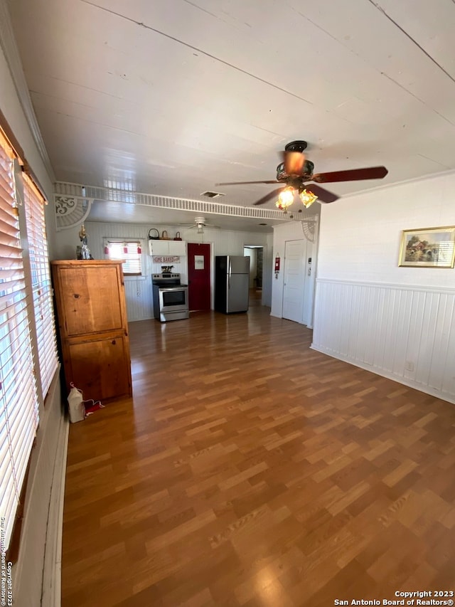 unfurnished living room featuring ceiling fan and dark wood-type flooring