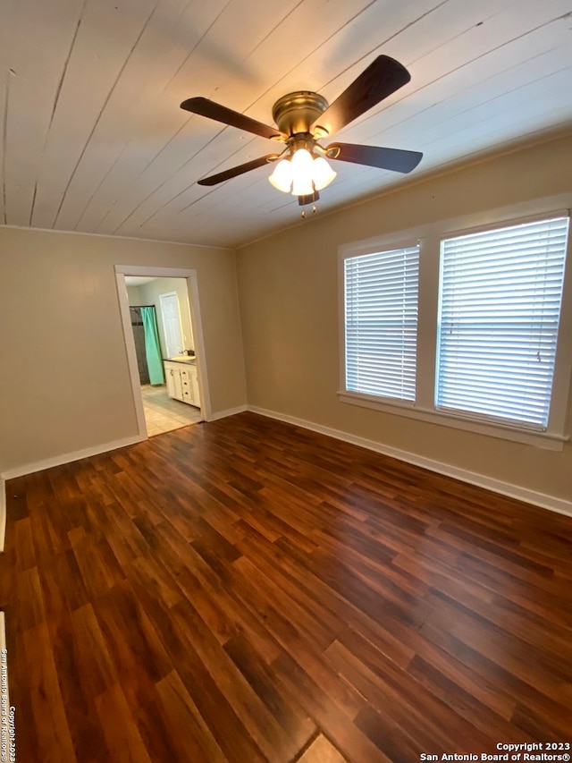 empty room featuring ceiling fan and wood-type flooring