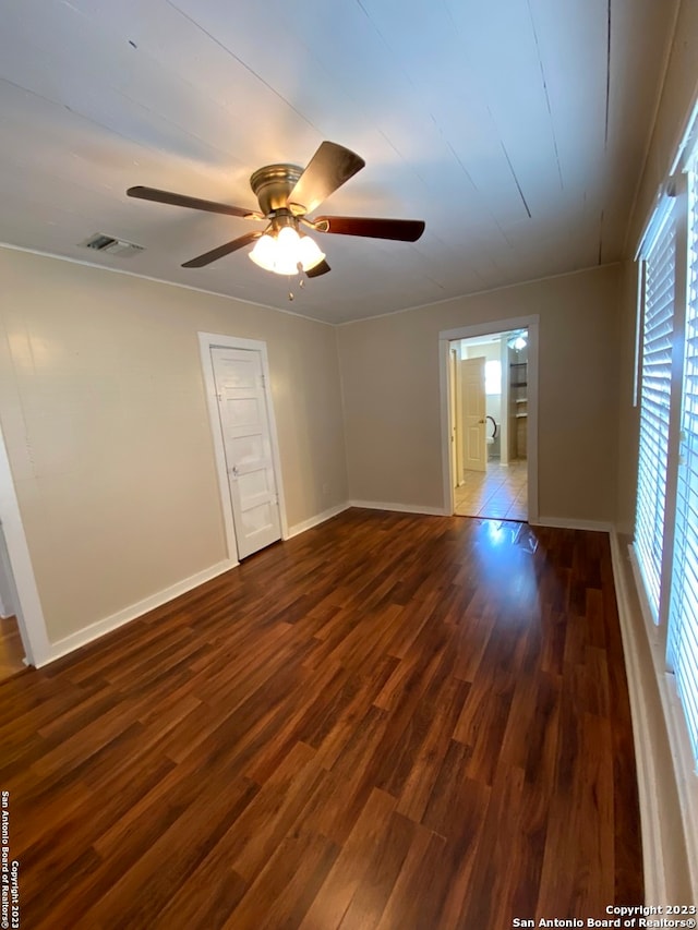 empty room featuring light hardwood / wood-style floors, ceiling fan, and a healthy amount of sunlight