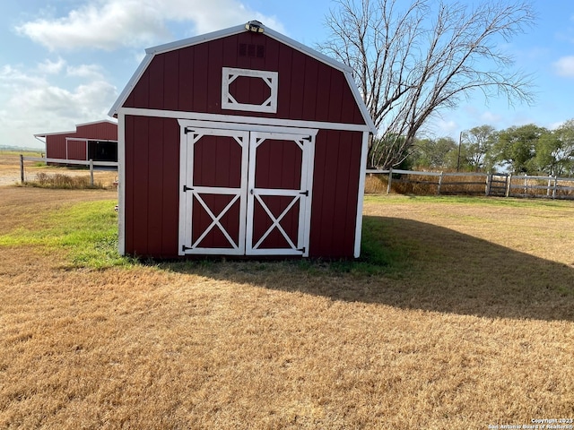 view of shed / structure with a lawn