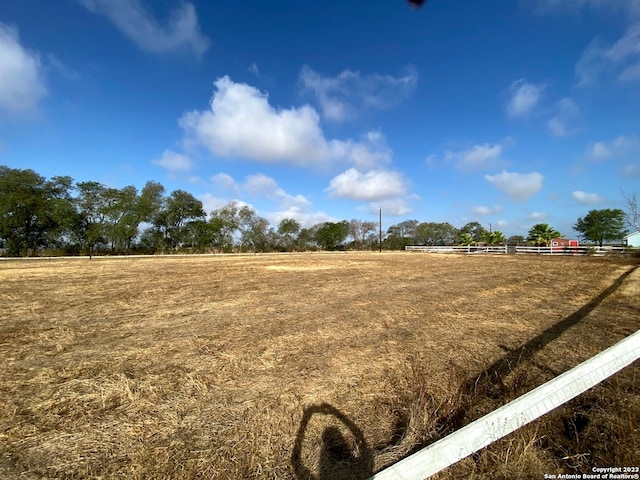 view of yard with a rural view