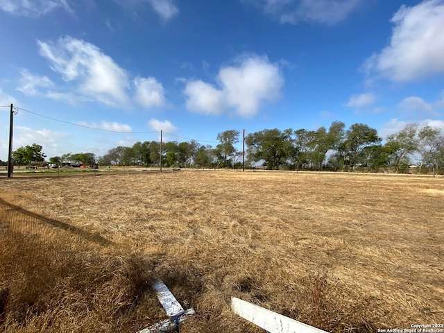 view of yard with a rural view