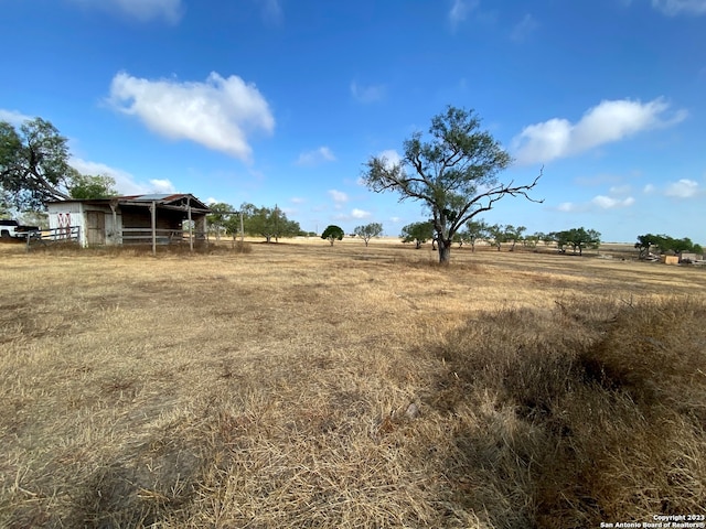 view of yard with a rural view