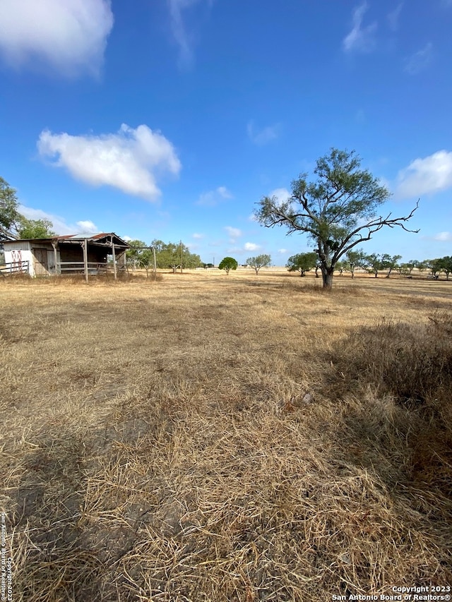 view of yard with a rural view