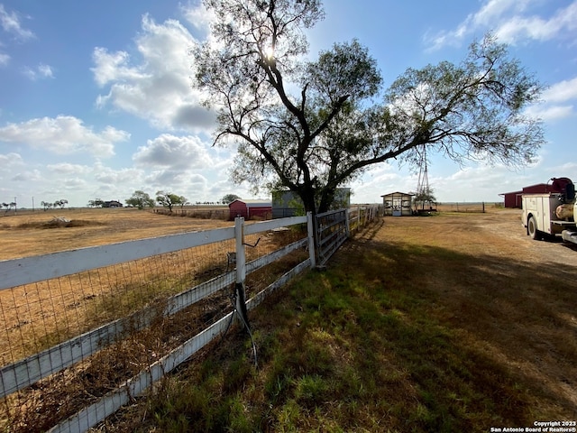 view of yard with a rural view