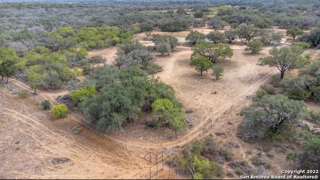 birds eye view of property with a rural view