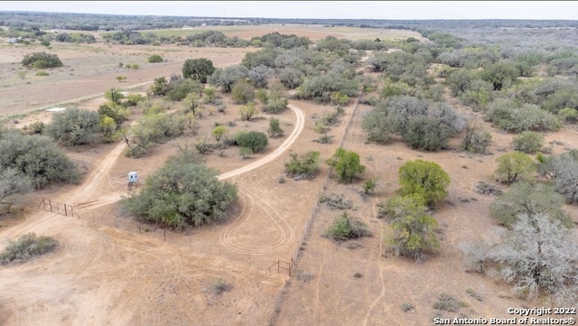 birds eye view of property featuring a rural view