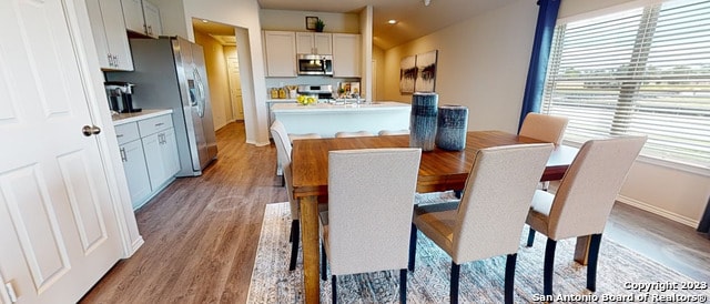 dining area featuring light wood-type flooring