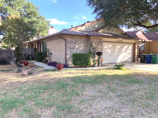 view of property exterior featuring a lawn and a garage